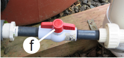 the RainWise low flow valve. The valve's tabs are oriented parallel to the pipe they are attached to. 
